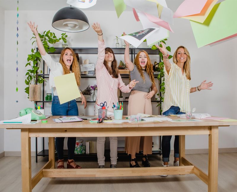 Happy teachers celebrating school automation