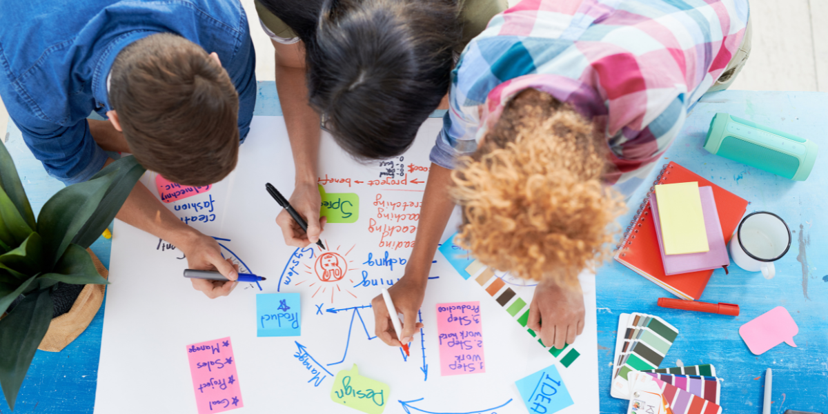 kids creating poster during creative classroom workshops